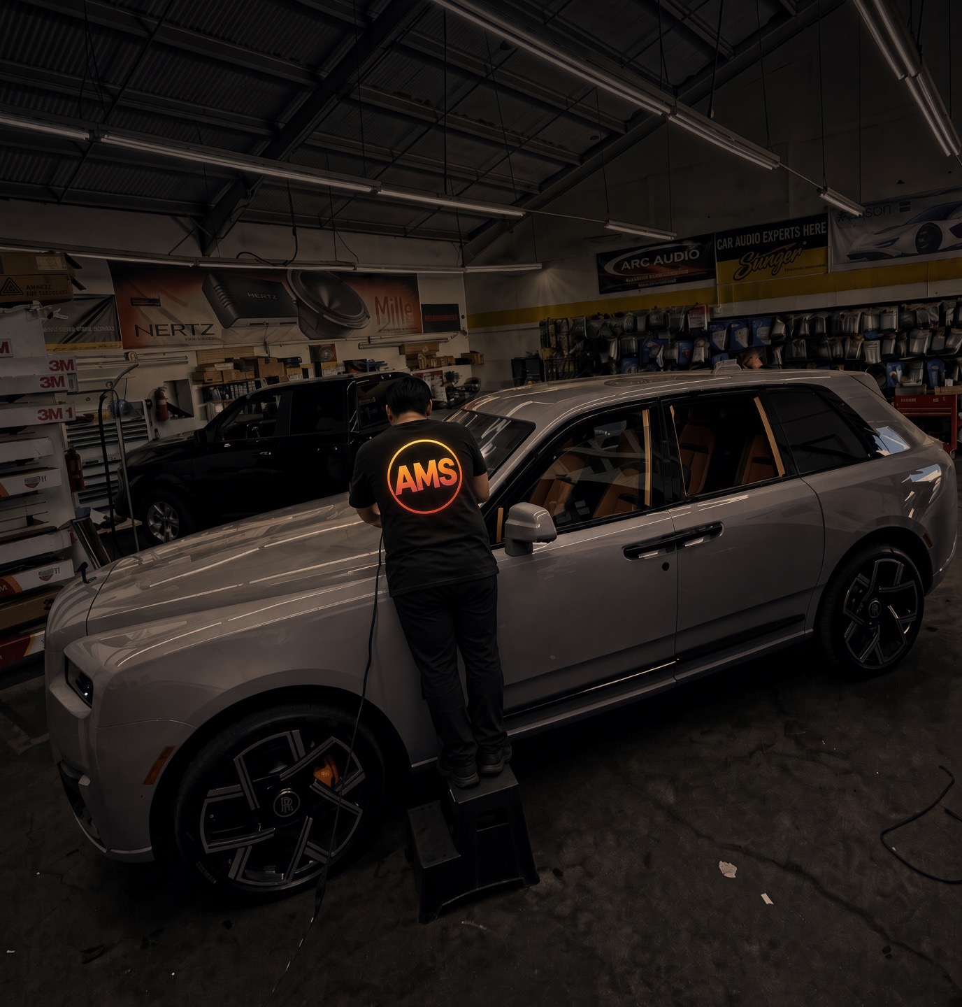 Hand-cut window tint on this Rolls-Royce Cullinan in the Carson shop